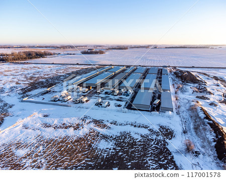 Drone view of a rental storage unit facility with closed bay doors. Drone view of a rental storage unit facility with closed bay doors. 117001578