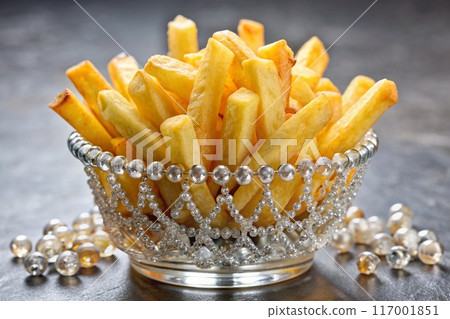 French fries in bowl with gems and crystals. Luxury fast food concept. French fries crown. Ai generated 117001851