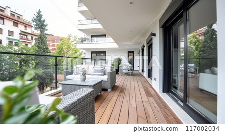 Modern Home Exterior With Glass Wall and Wooden Deck Surrounded by Nature 117002034