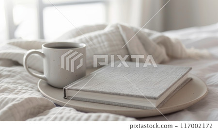 Cozy Morning Ritual With Coffee and Open Book on Soft Bedding 117002172