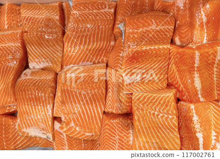 Top view of fresh raw salmon fillet displayed in wet market. Seafood concept Top view of fresh raw salmon fillet displayed in wet market. Seafood concept 117002761