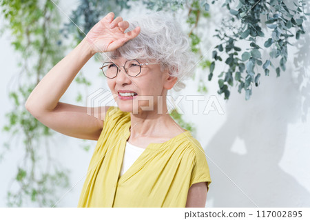 Senior woman suffering from heat stroke in summer Senior woman suffering from heat stroke in summer 117002895