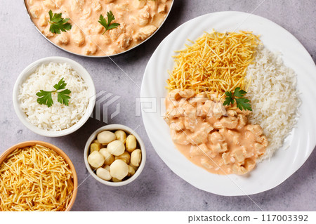homemade chicken stroganoff in ceramic dish isolated on cement table homemade chicken stroganoff in ceramic dish isolated on cement table 117003392