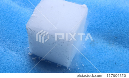 A piece of dry ice on a blue background A piece of dry ice on a blue background 117004850