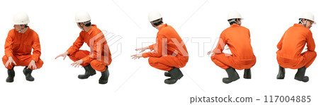 Full-body cutout of a man wearing a helmet in the factory or construction industry squatting Full-body cutout of a man wearing a helmet in the factory or construction industry squatting 117004885