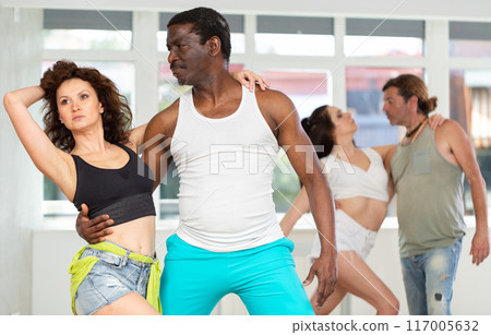 Man and woman dancing couple dance in studio 117005632