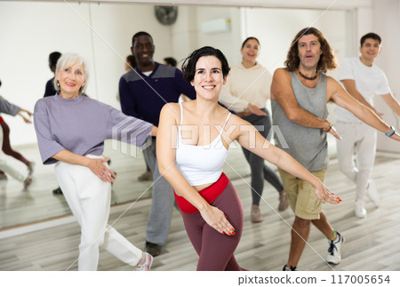 Young Hispanic woman practicing vigorous dance movements Young Hispanic woman practicing vigorous dance movements 117005654