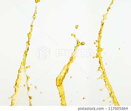 Fruit beverage water elements in line form . Fresh splashing and flowing jets, white background isolated freeze motion. Orange, lemon juice or oil lubricant splash, liquid gold yellow drink drops Fruit beverage water elements in line form . Fresh splashing and flowing jets, white background isolated freeze motion. Orange, lemon juice or oil lubricant splash, liquid gold yellow drink drops 117005864