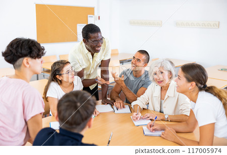Different people studying foreign languge together Different people studying foreign languge together 117005974