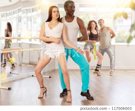Man and woman in heels dancing latin dances Man and woman in heels dancing latin dances 117006003