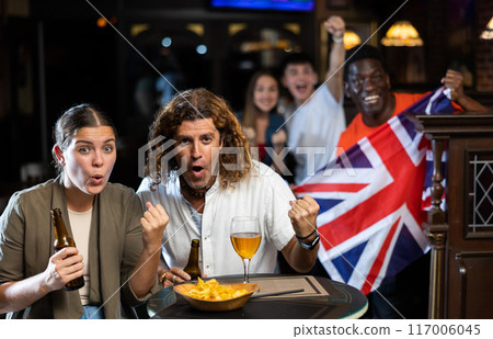 United Kingdom football team fans spending time in bar 117006045