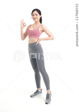 Beautiful young asian sport woman with sportswear ready for exercise on white background, Advertising sportswear and yoga wear, Healthy lifestyle, sport. 117006333