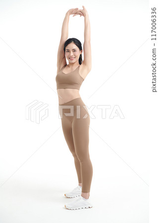 Beautiful young asian sport woman with sportswear ready for exercise on white background, Advertising sportswear and yoga wear, Healthy lifestyle, sport. Beautiful young asian sport woman with sportswear ready for exercise on white background, Advertising sportswear and yoga wear, Healthy lifestyle, sport. 117006336