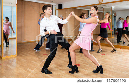 young woman dances cha-cha-cha 117006390