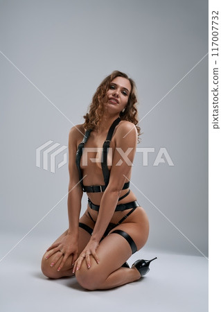 Dangerous woman in bondage standing on her knees Dangerous woman in bondage standing on her knees 117007732