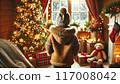 Back view of a child watching snowfall on Christmas day 117008042