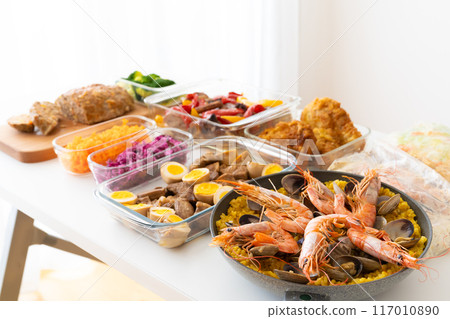 Prepared food on a table by the window Prepared food on a table by the window 117010890