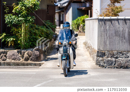 Monk riding a motorcycle 117011030