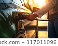 Eco-Friendly Journey Woman Charges Her Electric Car at a Charging Station. created with Generative AI 117011096
