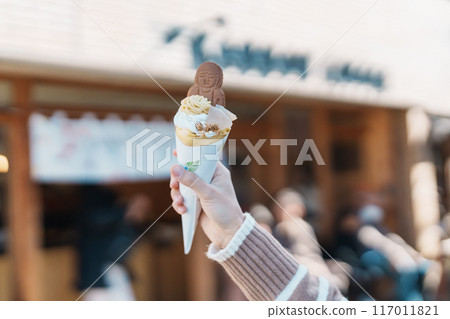 Woman showing Daibutsu or Buddha yogurt crepe, popular dessert in Kamakura, Kanakawa, Japan 117011821