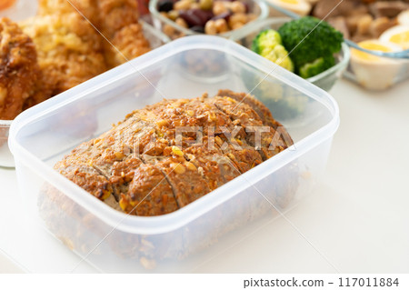 Vegetable meadloaf in a Tupperware container 117011884