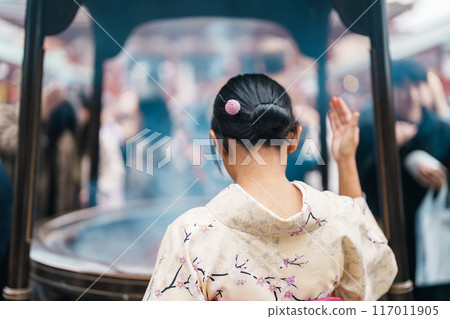 Tourists visit Sensoji Temple or Asakusa Kannon Temple is a Buddhist temple located in Asakusa. Landmark and popular for tourist attraction and Travel destination in Tokyo, Japan and Asia concept 117011905