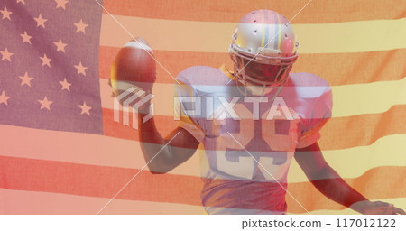 Image of african american american football player with ball and helmet and flag of usa Image of african american american football player with ball and helmet and flag of usa 117012122