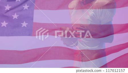 Image of african american american football player with ball and flag of usa Image of african american american football player with ball and flag of usa 117012157