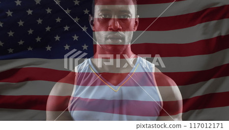 Image of flag of usa over african american male basketball player 117012171