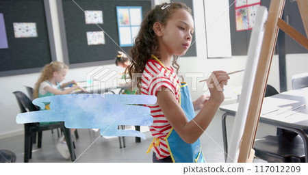 Painting on canvas, girl in striped shirt and apron in classroom image 117012209