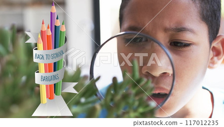 Examining plant with magnifying glass, boy over back to school bargains image Examining plant with magnifying glass, boy over back to school bargains image 117012235