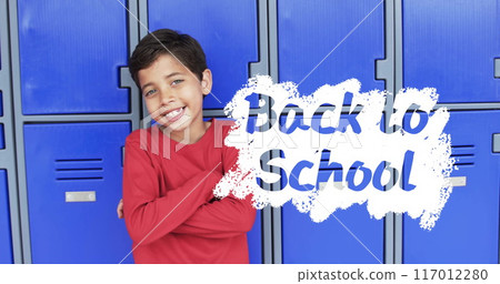 Standing with arms crossed, boy in red shirt over Back to School text, image 117012280
