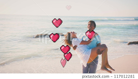 Image of hearts moving over biracial man carrying woman on beach in summer Image of hearts moving over biracial man carrying woman on beach in summer 117012281