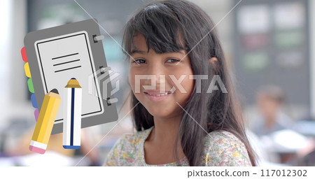 Smiling girl in classroom with notebook and pencils image over her Smiling girl in classroom with notebook and pencils image over her 117012302