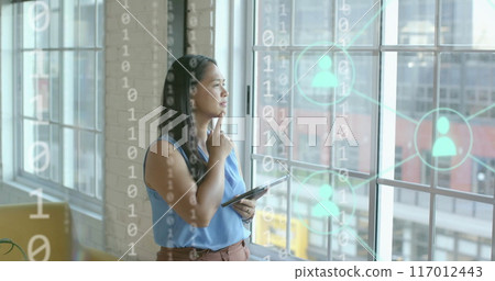 Image of financial data processing over biracial businesswoman in office Image of financial data processing over biracial businesswoman in office 117012443