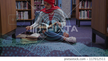 Image of ai text and data over biracial female student in hijab reading book Image of ai text and data over biracial female student in hijab reading book 117012511