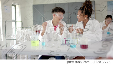 Image of scientific data processing over diverse students in laboratory 117012772