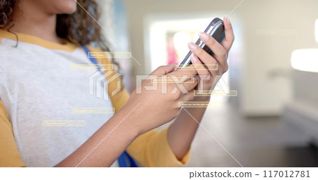 Image of digital data processing over biracial female student using smartphone in school Image of digital data processing over biracial female student using smartphone in school 117012781