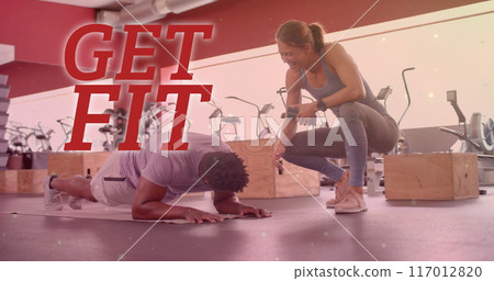 Image of get fit text over diverse man and woman exercising in gym Image of get fit text over diverse man and woman exercising in gym 117012820