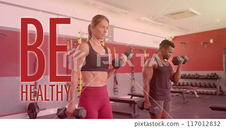 Image of be healthy text over diverse man and woman exercising in gym Image of be healthy text over diverse man and woman exercising in gym 117012832
