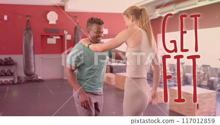 Image of get fit text over diverse man and woman exercising in gym Image of get fit text over diverse man and woman exercising in gym 117012859