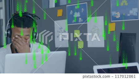 Image of binary coding data processing over african american businessman in office Image of binary coding data processing over african american businessman in office 117012861