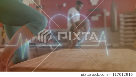 Image of data processing over diverse man and woman exercising in gym Image of data processing over diverse man and woman exercising in gym 117012916