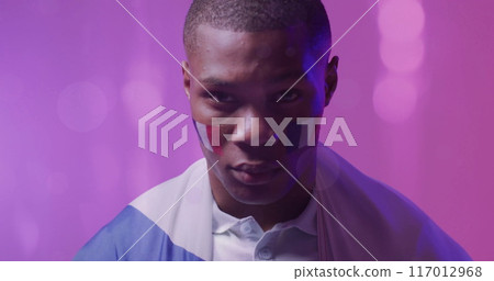 Image of glowing lights over african american man with flag of france on face Image of glowing lights over african american man with flag of france on face 117012968
