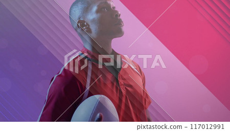 Image of flag of france over african american male rugby player with ball 117012991