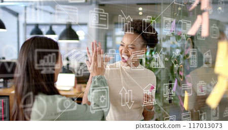 Image of currency and data processing over diverse businesswomen in office 117013073