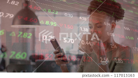 Image of financial data processing over african american businesswoman in office Image of financial data processing over african american businesswoman in office 117013163