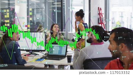 Image of green graph processing data over diverse colleagues high fiving at casual office Image of green graph processing data over diverse colleagues high fiving at casual office 117013332