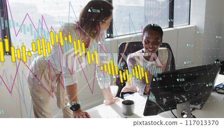 Image of graph processing data over diverse female colleagues talking at desk in casual office 117013370