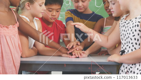 Image of math formulas over diverse pupils at school 117013633